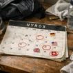 messy desk HYROX calendar with circled dates and country flags athlete planning race schedule realistic scene