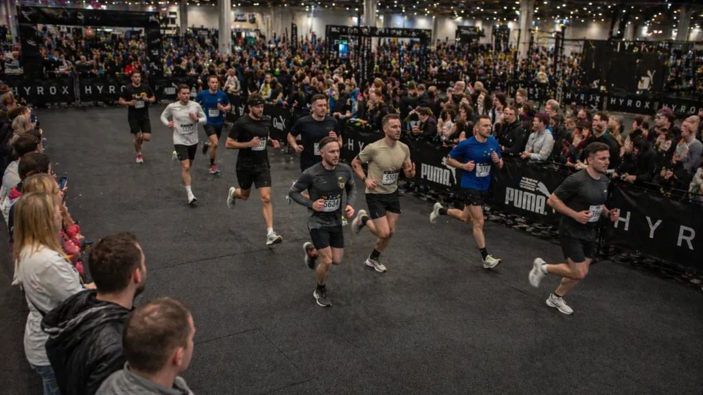 HYROX running pace corridor view inside exhibition hall during competition