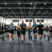 What is HYROX — athletes competing inside an indoor fitness race exhibition hall