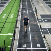 HYROX race floor with all 8 stations — complete HYROX station times guide for Open and Pro divisions