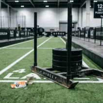 Loaded HYROX sled on official turf track ready for sled push and pull for HYROX training session