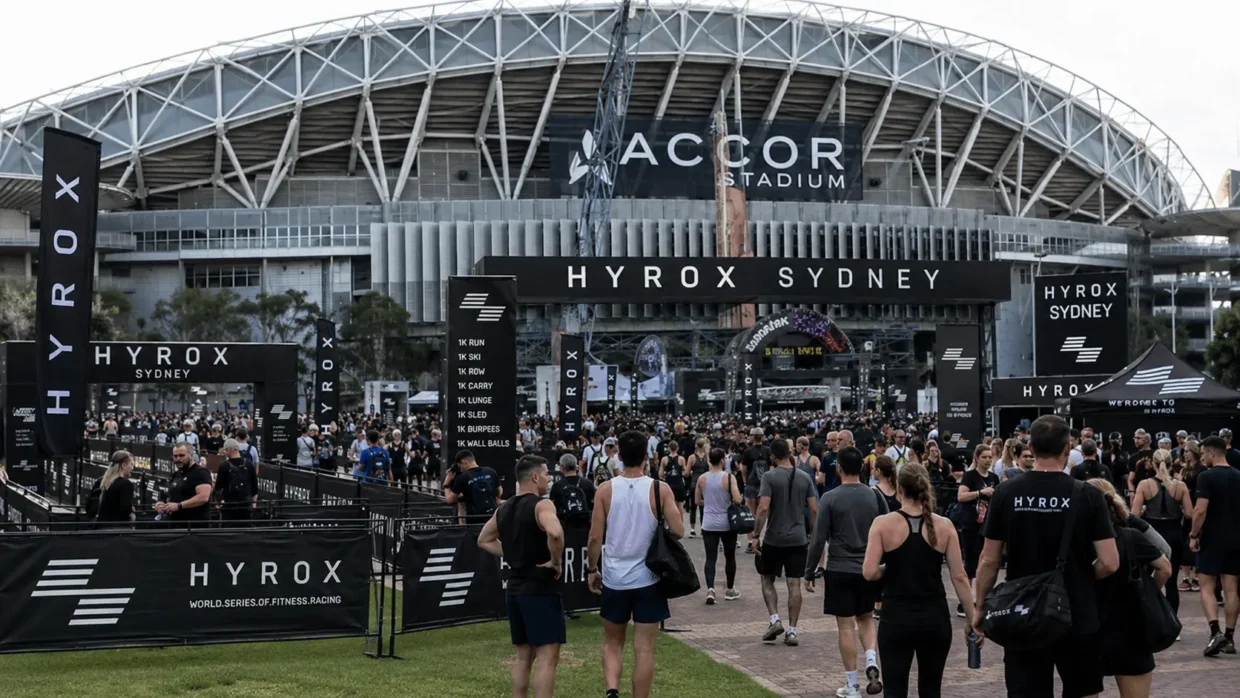 Crowd of athletes arriving at HYROX Sydney at Accor Stadium — the full HYROX cost in Australia goes well beyond the entry fee