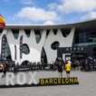 HYROX cost in Spain — HYROX Barcelona venue entrance at Fira Barcelona with Spanish flag and athletes arriving on race day