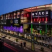 Brisbane Convention & Exhibition Centre lit up at dusk during HYROX Brisbane check-in