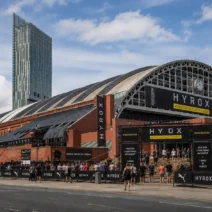 Manchester Central Convention Complex entrance during HYROX Manchester, with the Beetham Tower in the background
