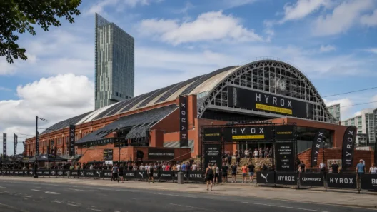 Manchester Central Convention Complex entrance during HYROX Manchester, with the Beetham Tower in the background