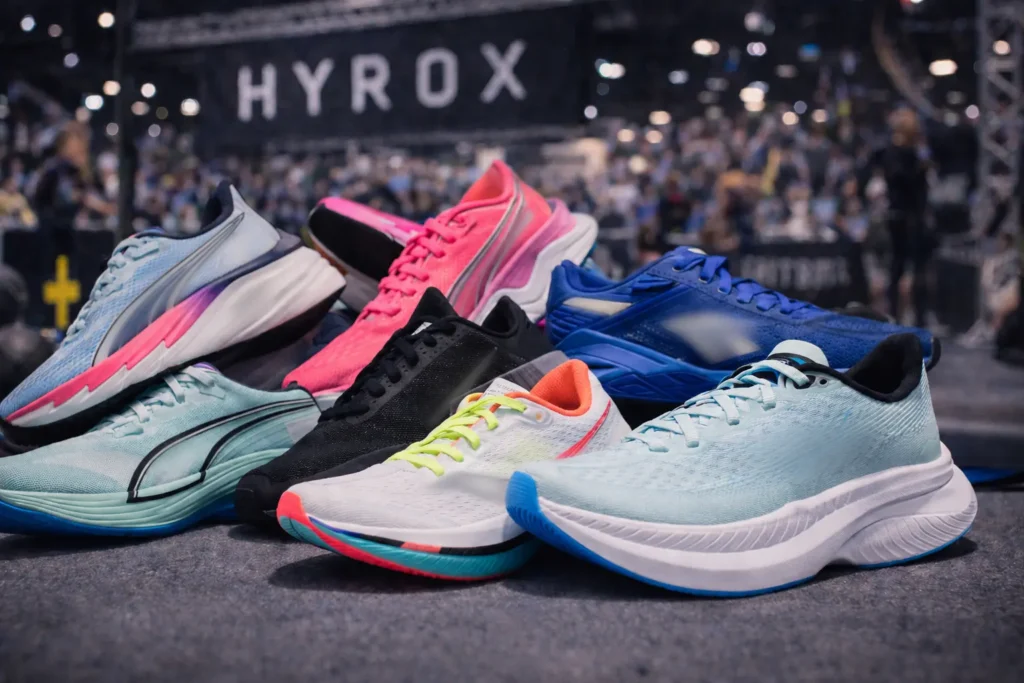 Running shoes lined up at a HYROX event, part of a best HYROX equipment 2026 shoe comparison