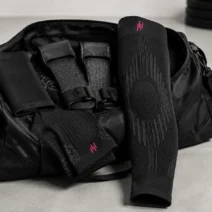 HYROX gear bag with compression knee sleeve, socks and grip gloves, part of a best HYROX equipment 2026 kit
