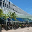 Miami Beach Convention Center exterior during a HYROX Miami race day, palm trees lining the entrance