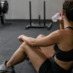 Athlete resting and rehydrating after finishing a HYROX race
