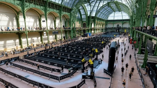 Aerial view of the HYROX race floor inside the Grand Palais, showing the venue's iconic glass and iron roof