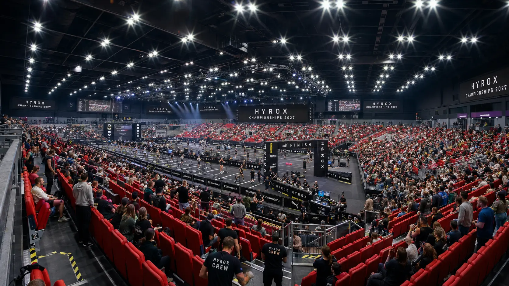Packed arena crowd watching the HYROX World Championships 2027 finish line