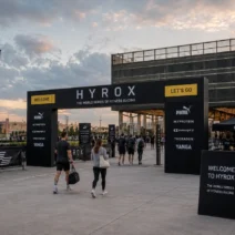 MEETT Parc des Expositions entrance at dusk during HYROX Toulouse, with athletes arriving