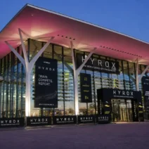Eurexpo Lyon entrance lit up at dusk during HYROX Lyon