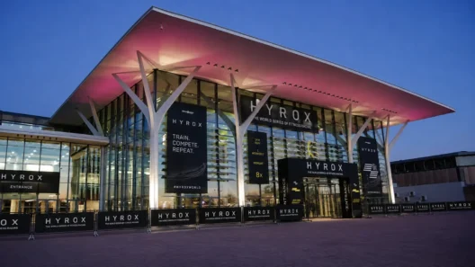 Eurexpo Lyon entrance lit up at dusk during HYROX Lyon
