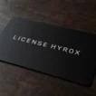 HYROX athlete license card resting on a wooden table