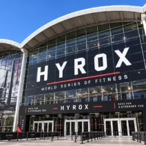 HYROX Hamburg 2026 race floor with SkiErg machines and sled lanes on rubber tiles in an indoor hall